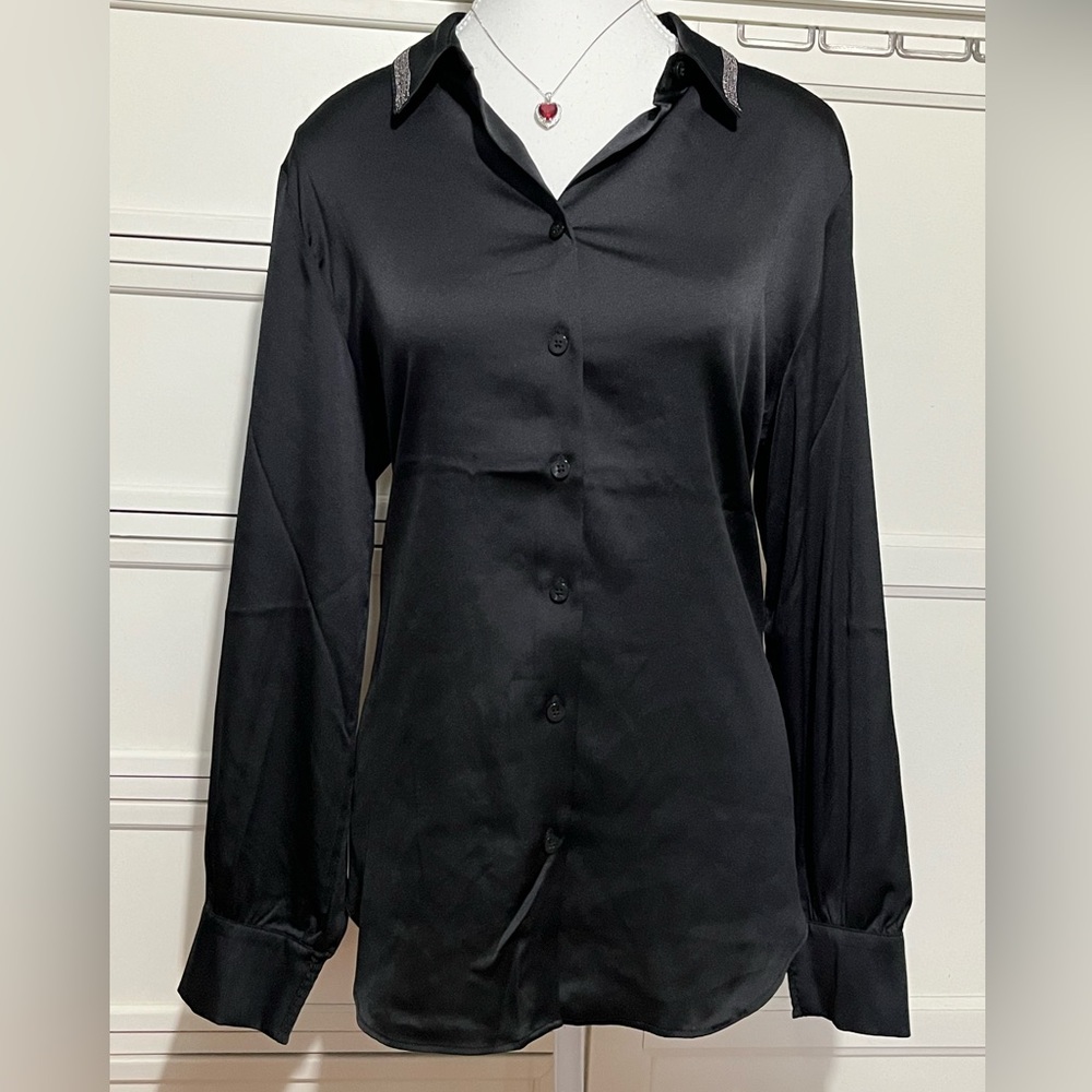 NWT. CHICO’S black dressy blouse with detailed collar. Sizes 10 & 12 available